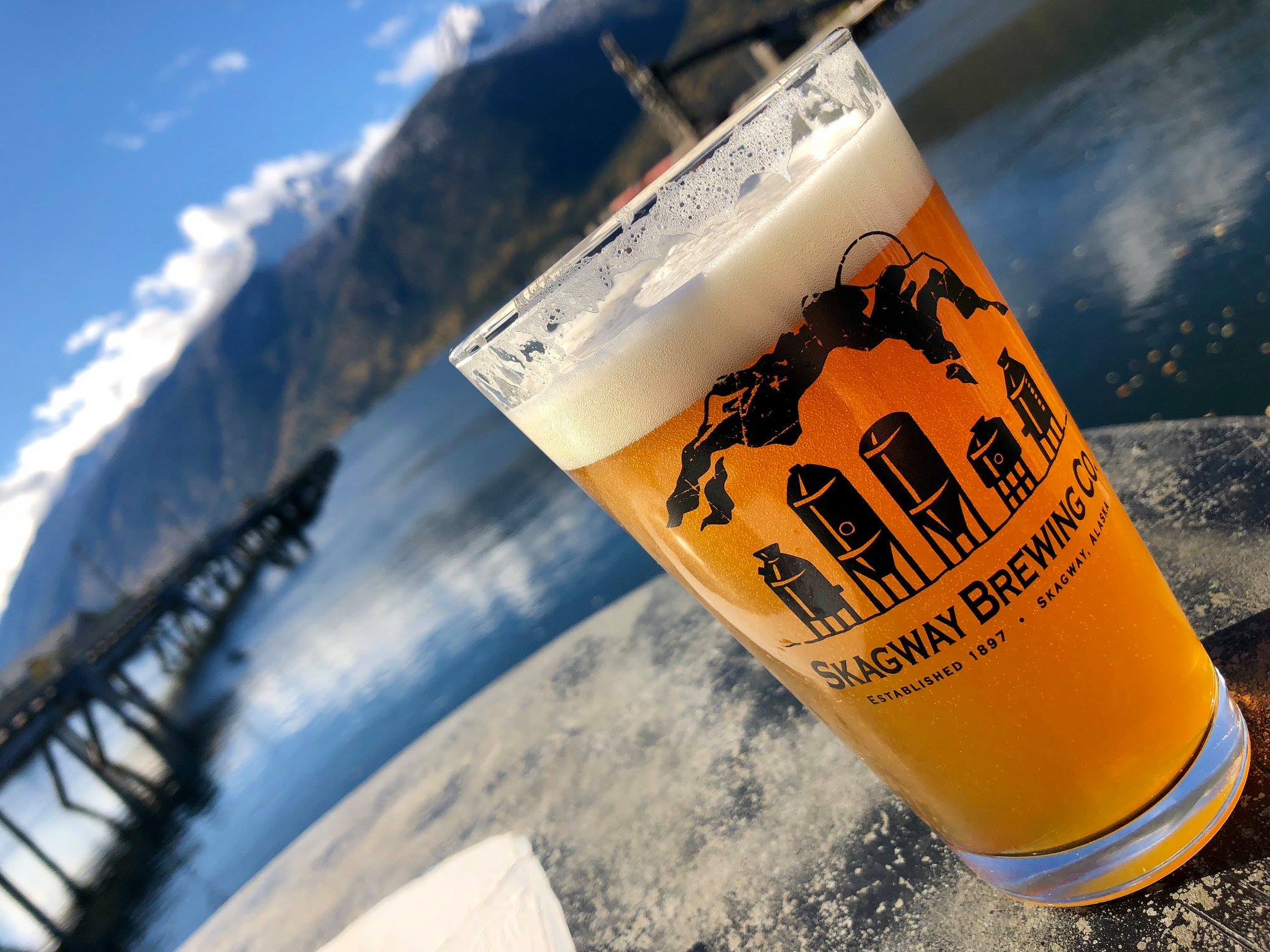 A glass of the signature spruce tip blonde beer brewed in skagway