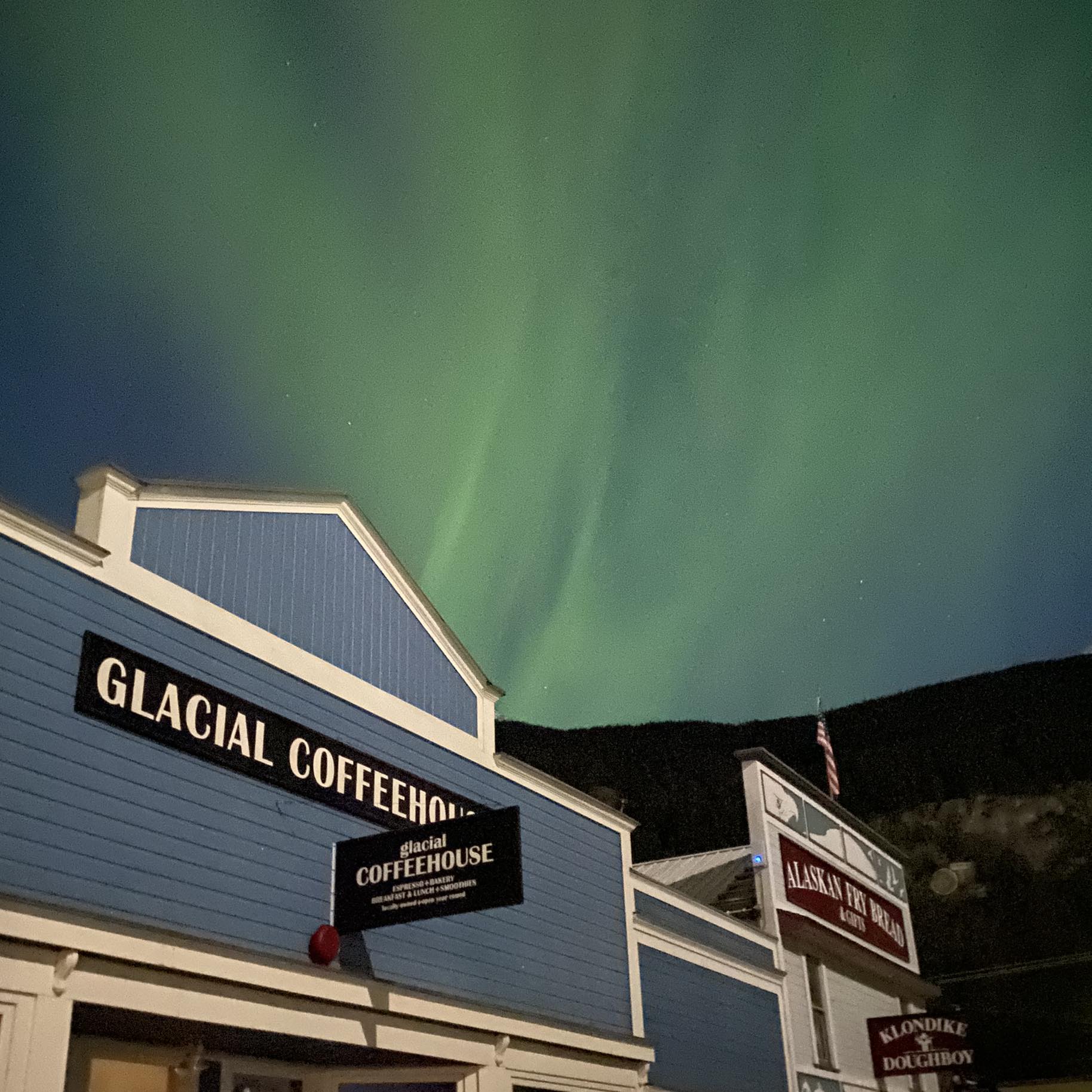 Northern Lights over the Glacial Coffeehouse building.